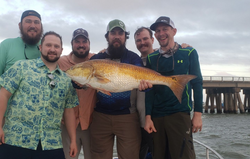 A group of 6 people fishing in TX