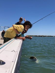 Two people fishing in Galveston