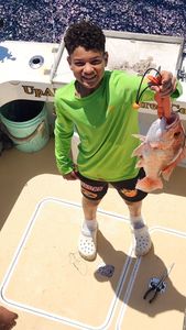 Single fisherman angler catching fish in Galveston