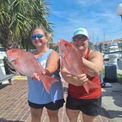 A photograph of two people fishing in St. Augustine