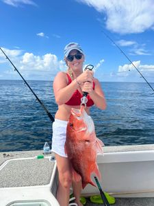 A lone fisherman in Alabama catching a 23-inch fish