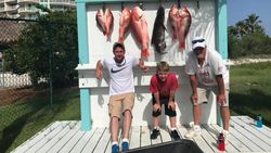 A group of 5 people fishing in the Gulf Shores region