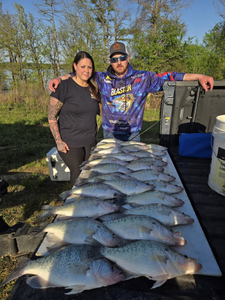 Large catch of fish displayed on cleaning table after successful fishing trip in North East PA