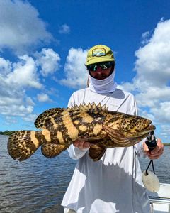 Successful angler with a big fish in Naples