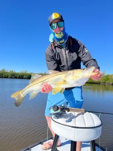 Angler fishing with rod and reel in Naples