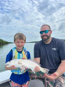 Angler holding a redfish in Florida