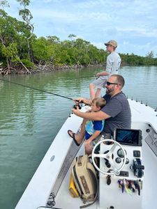 Three people fishing in FL