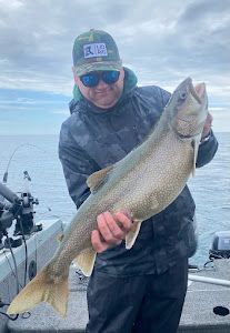 Angler fishing in Duluth, catching a 26-inch fish