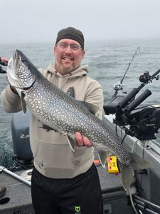Angler catching a lake trout in Minnesota