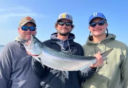 Angler with a large rainbow trout caught in MN