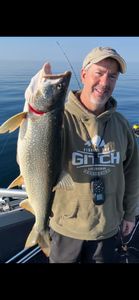 A lone fisherman catches a Lake Trout in Duluth