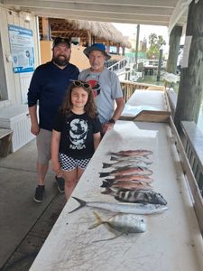 Fresh catch of Crevalle Jack and Spanish Mackerel displayed on fishing dock in Port Orange FL