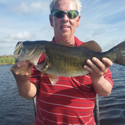 A fisherman catches a big fish in Fellsmere, Florida.