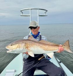 A person fishing in Panacea