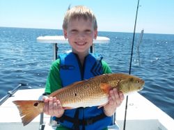 Fisherman with a 15-inch catch in Panacea