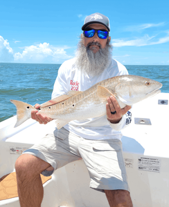 Angler with a 26-inch fish caught in Panacea
