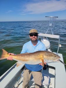 Angler with fishing rod at Panacea