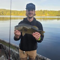 A fisherman holds a Smallmouth Bass measuring 17 inches in Union