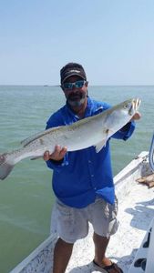 A lone fisherman in Port Isabel