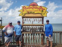 Three anglers fishing in Port Isabel