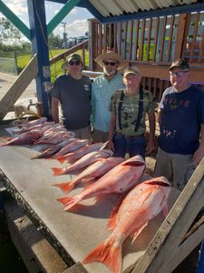 4 people fishing at Port Isabel