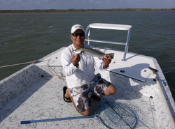 A person fishing in Port Isabel