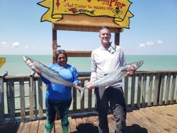 Two people fishing in Port Isabel