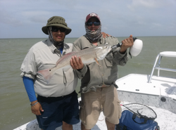 Two people fishing in TX