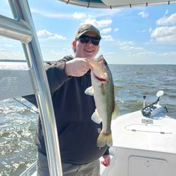 Stoked with a hefty largemouth bass—solid catch!
