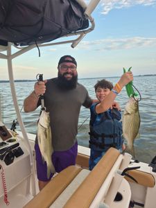 Two anglers fishing for wiper and striped bass in Willis