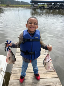 Two fishing hooks with two fish caught in TX