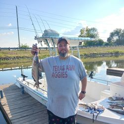 A white catfish measuring 14 inches from TX.
