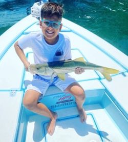 Angler with a big fish on the line in Miami Beach