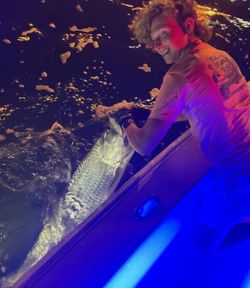 Angler with a fish at Miami Beach