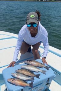 Two fishing rods with 2 fish caught in FL