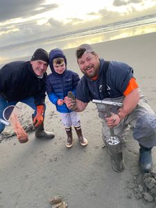 Four people enjoying a day of fishing on Peter Iredale Rd
