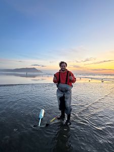 Angler fishing with rod and reel on Peter Iredale Rd