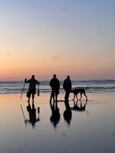 Three people enjoying a fishing trip at Peter Iredale Rd