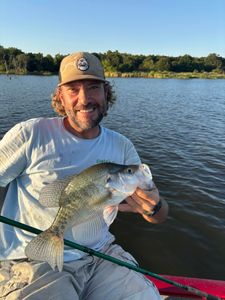 A lone angler fishing in the waters of OK