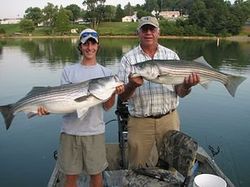 Two anglers with a catch of two large fish in Bristol