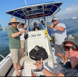 Group of 6 people fishing on the beach in Fort Myers Beach