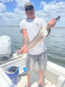 A person fishing in FL