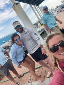 Four people fishing on the coast of Florida