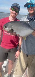 Permit fish caught by two people at Fort Myers Beach