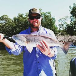 Angler holding a redfish in Florida