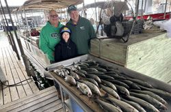 Three people enjoying a great fishing and hunting adventure in Pottsboro