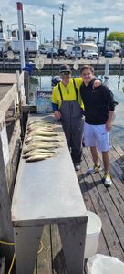 Two people fishing in MI