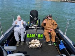 Two people enjoying fishing in MI