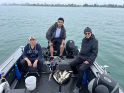 Three people fishing in MI