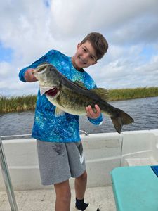 Large bass fish being held on fishing boat in Kissimmee FL